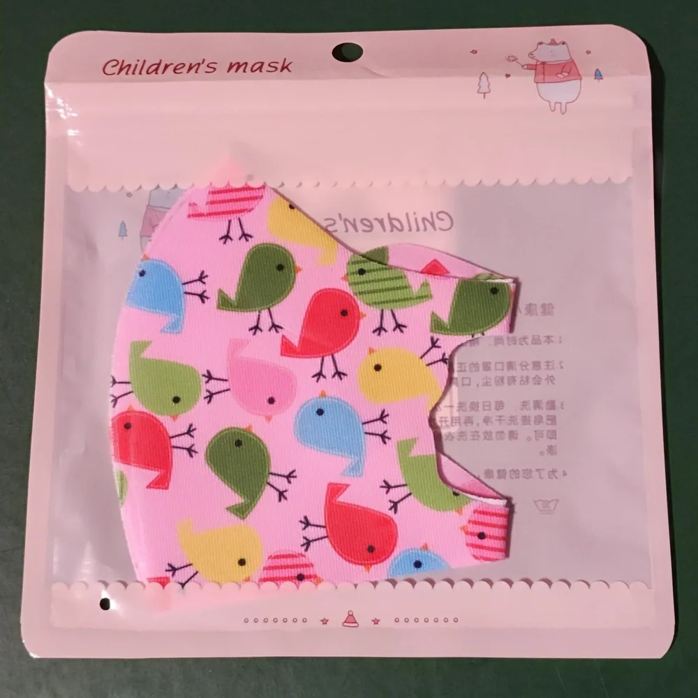 Children's re Usable face mask new in package never opened